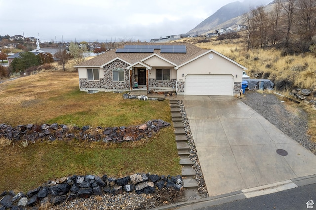 3870 Mountain Top Cir W, Cedar Hills, UT 84062 - ranch-style house with solar panels, a garage, a mountain view, and a front lawn