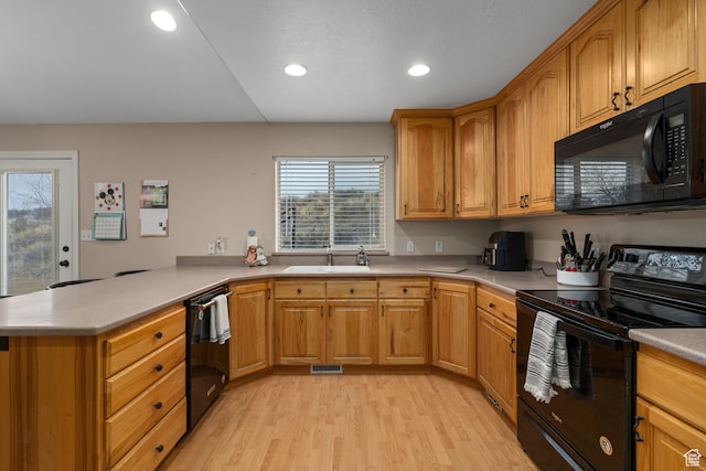 3870 Mountain Top Cir W, Cedar Hills, UT 84062 - kitchen featuring black appliances, light hardwood / wood-style floors, kitchen peninsula, and sink