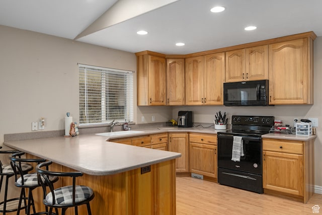 3870 Mountain Top Cir W, Cedar Hills, UT 84062 - kitchen featuring lofted ceiling, black appliances, sink, light hardwood / wood-style floors, and kitchen peninsula