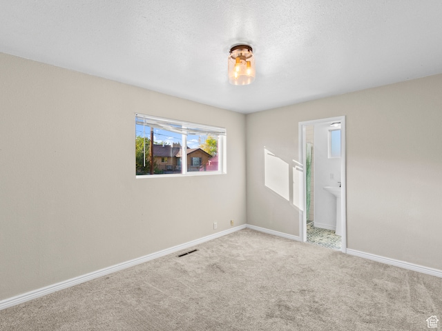 552 E 250 N, Bountiful, UT 84010 - carpeted spare room featuring a textured ceiling