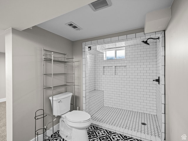 552 E 250 N, Bountiful, UT 84010 - bathroom featuring tile patterned flooring, a tile shower, and toilet