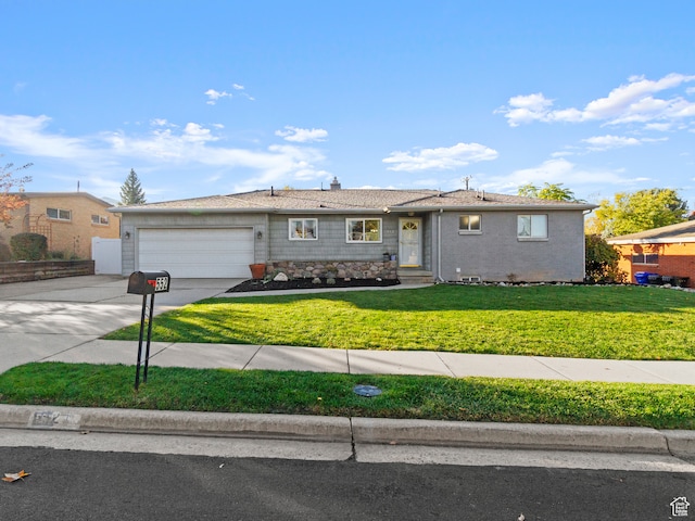 ranch-style house featuring a front lawn and a garage