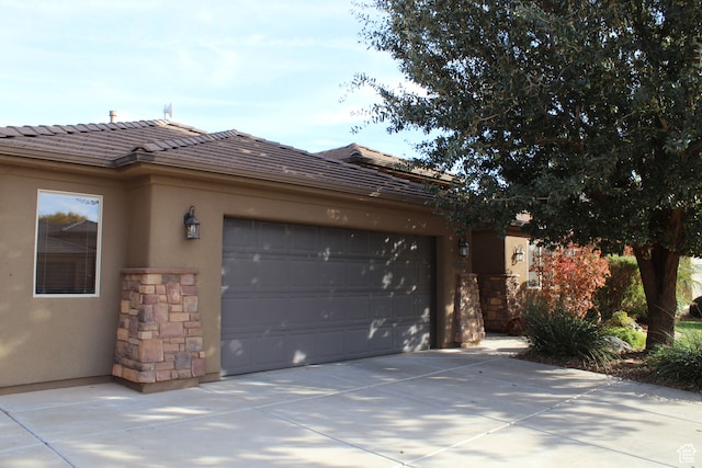 view of side of property featuring a garage