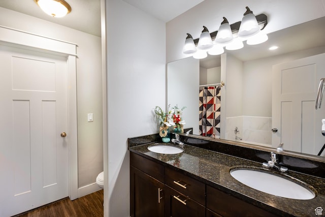 279 W 20 N, Hyrum, UT 84319 - bathroom featuring vanity, hardwood / wood-style flooring, and toilet