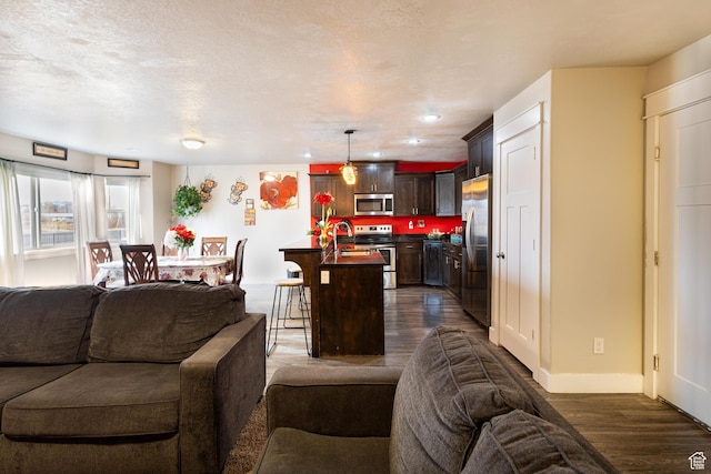 279 W 20 N, Hyrum, UT 84319 - living room with a textured ceiling and dark hardwood / wood-style flooring