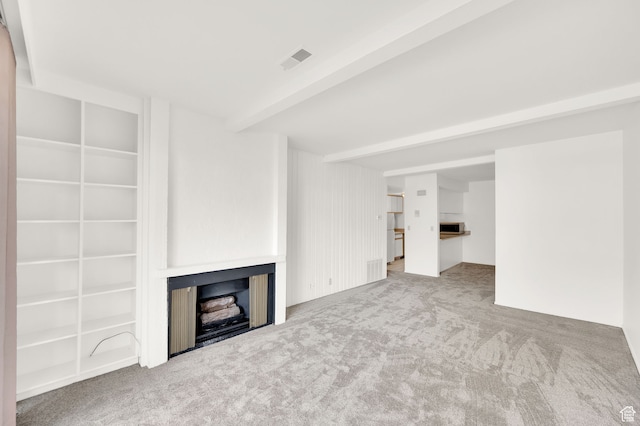 31 N M St E Unit 308, Salt Lake City, UT 84103 - unfurnished living room with carpet and beam ceiling