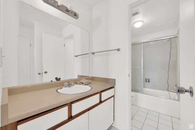 31 N M St E Unit 308, Salt Lake City, UT 84103 - full bathroom featuring tile patterned floors, vanity, bath / shower combo with glass door, and toilet