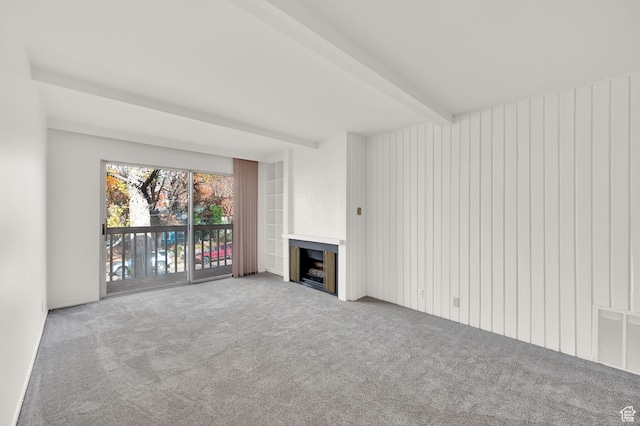 31 N M St E Unit 308, Salt Lake City, UT 84103 - unfurnished living room with beamed ceiling and carpet floors