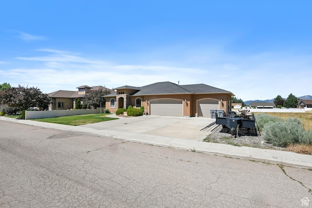 545 N 1100 E, Beaver, UT 84713 - mediterranean / spanish-style home featuring an attached garage, concrete driveway, and stucco siding
