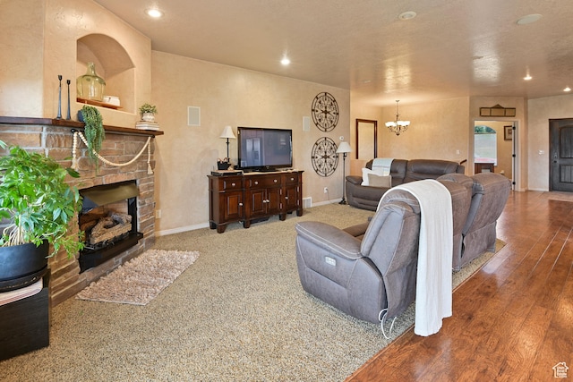 545 N 1100 E, Beaver, UT 84713 - living room with a chandelier, recessed lighting, baseboards, a fireplace with flush hearth, and wood finished floors