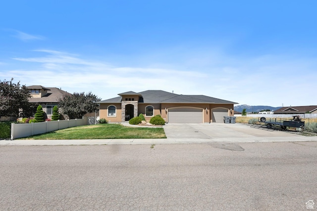 545 N 1100 E, Beaver, UT 84713 - mediterranean / spanish-style home featuring a garage, driveway, and stucco siding