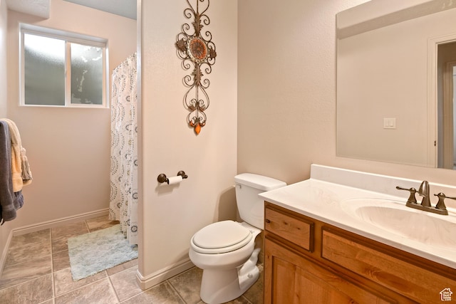 545 N 1100 E, Beaver, UT 84713 - bathroom with vanity, toilet, baseboards, and a shower with curtain