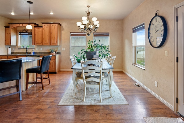 545 N 1100 E, Beaver, UT 84713 - dining space featuring a chandelier, baseboards, dark wood-type flooring, recessed lighting, and a textured wall