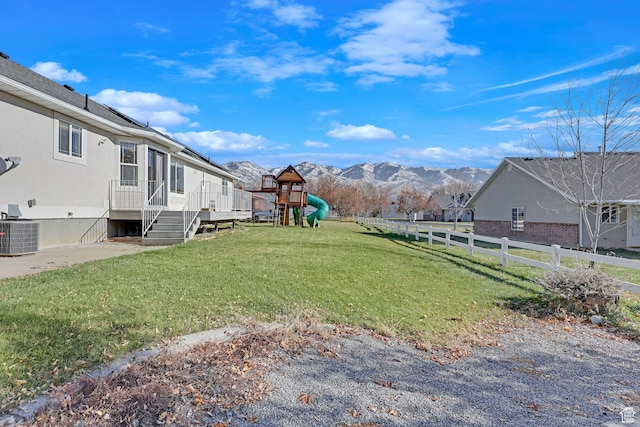 98 W 400 S, Smithfield, UT 84335 - view of yard featuring a playground, central AC, and a deck with mountain view
