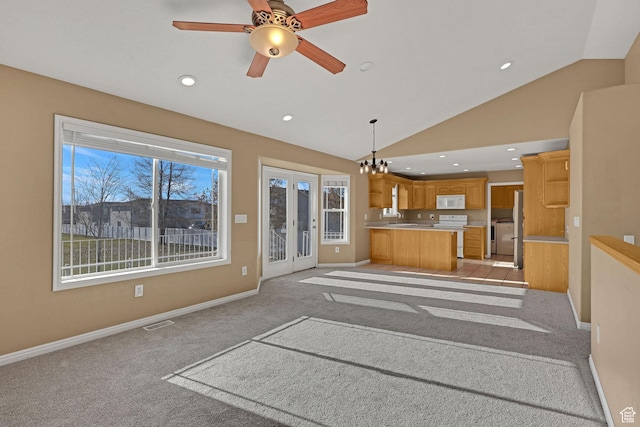 98 W 400 S, Smithfield, UT 84335 - unfurnished living room with light colored carpet, baseboards, vaulted ceiling, recessed lighting, and a sink