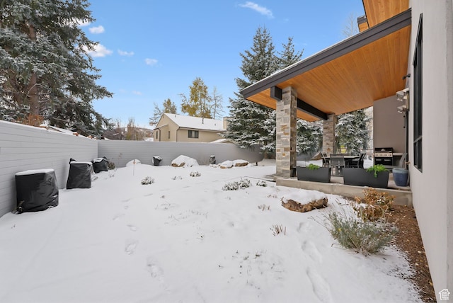 view of yard covered in snow