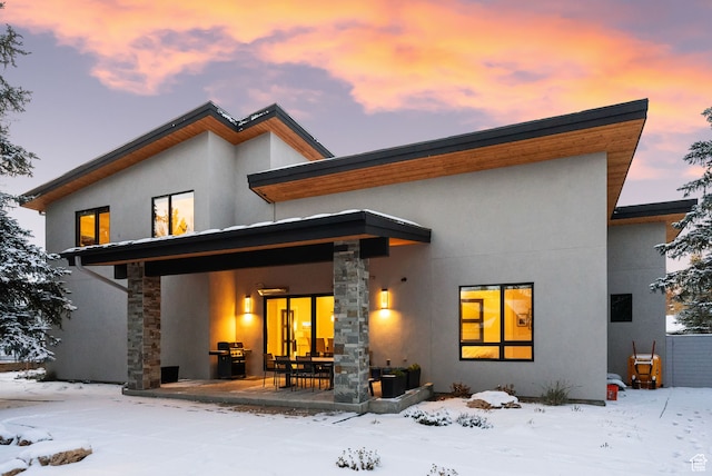 view of snow covered house