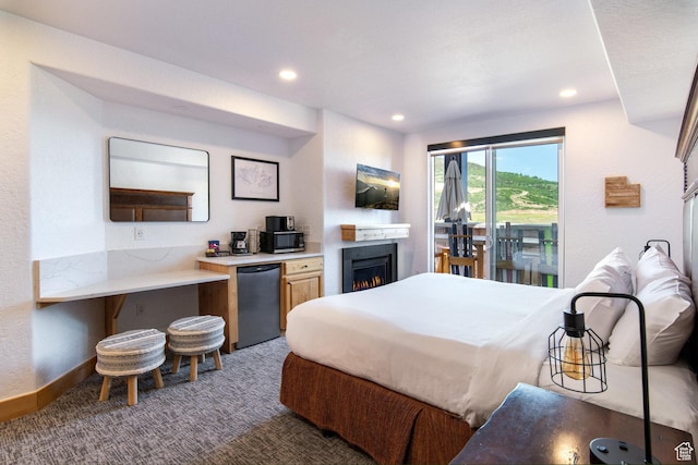 2653 W Canyons Resort Dr Unit 322, Park City, UT 84098 - carpeted bedroom with fridge, recessed lighting, a warm lit fireplace, and access to outside