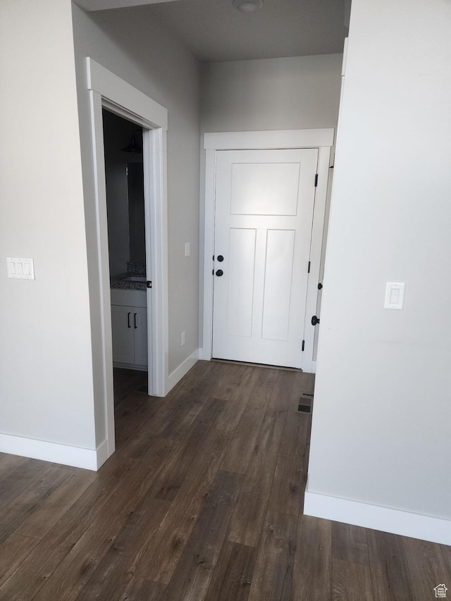 9781 N Aaron Ave Unit 207, Eagle Mountain, UT 84005 - corridor with dark wood-style flooring and baseboards