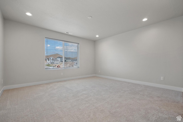 9781 N Aaron Ave Unit 207, Eagle Mountain, UT 84005 - unfurnished room with light carpet and recessed lighting