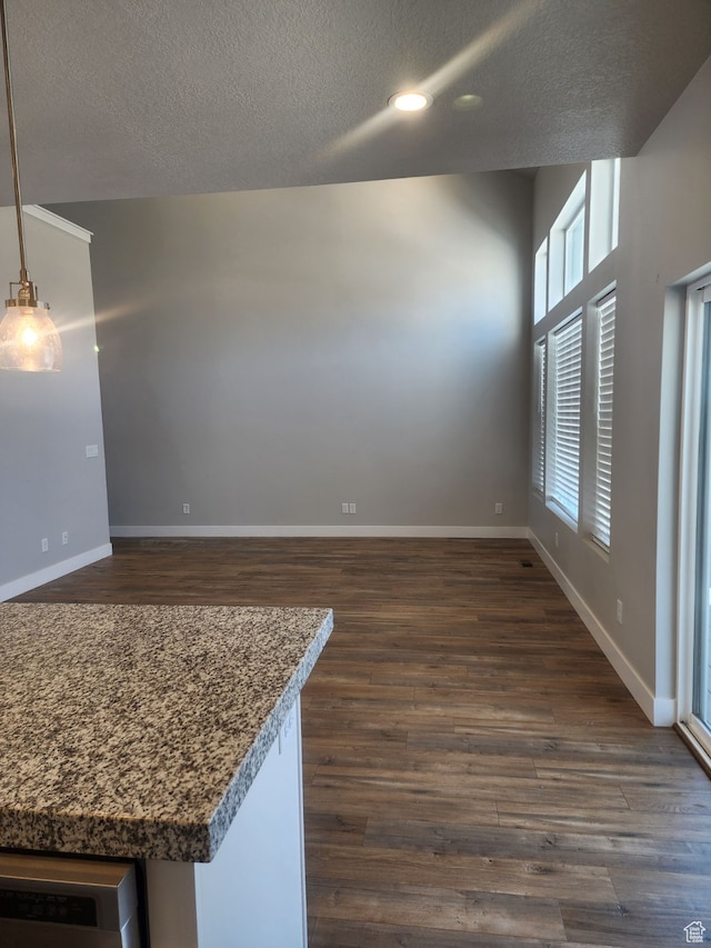 9781 N Aaron Ave Unit 207, Eagle Mountain, UT 84005 - interior space with a textured ceiling and dark wood-type flooring
