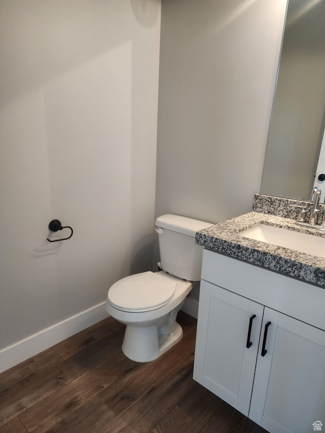 9781 N Aaron Ave Unit 207, Eagle Mountain, UT 84005 - bathroom with hardwood / wood-style flooring, vanity, and toilet