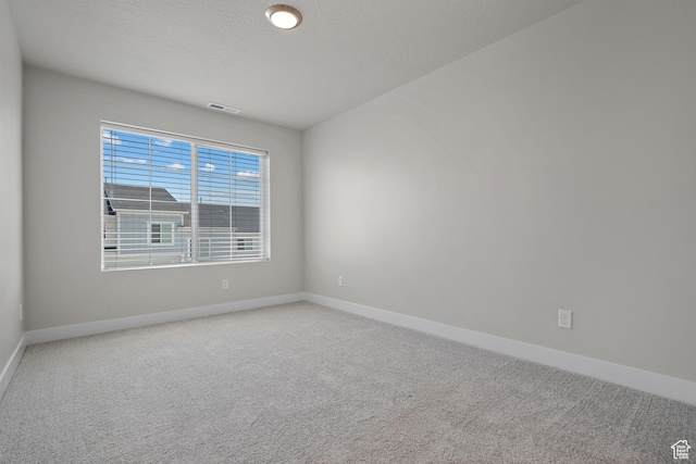 9781 N Aaron Ave Unit 207, Eagle Mountain, UT 84005 - spare room featuring carpet flooring
