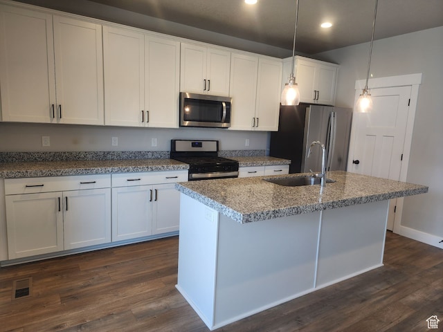 9781 N Aaron Ave Unit 207, Eagle Mountain, UT 84005 - kitchen with appliances with stainless steel finishes, sink, pendant lighting, dark hardwood / wood-style floors, and white cabinetry