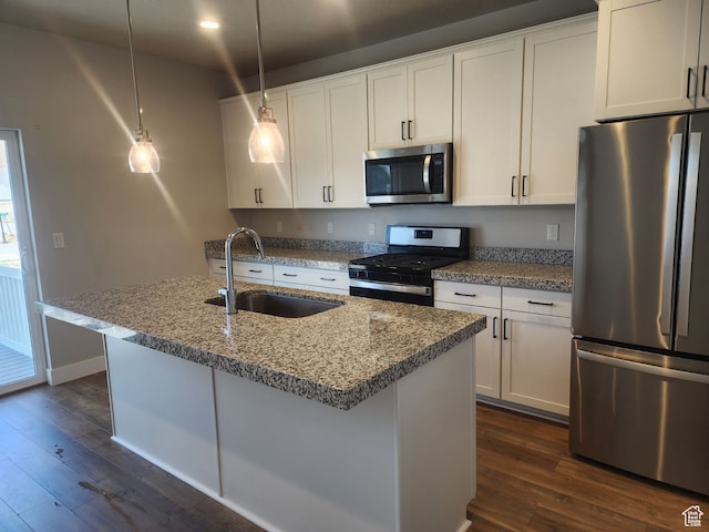 9781 N Aaron Ave Unit 207, Eagle Mountain, UT 84005 - kitchen with white cabinetry, sink, hanging light fixtures, dark hardwood / wood-style flooring, and appliances with stainless steel finishes