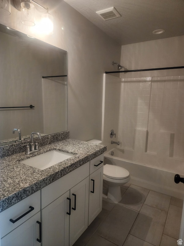 9781 N Aaron Ave Unit 207, Eagle Mountain, UT 84005 - full bathroom featuring tile patterned floors, vanity, a textured ceiling, shower / bathing tub combination, and toilet