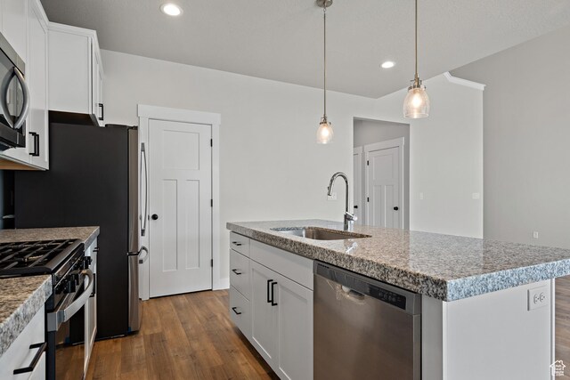 9781 N Aaron Ave Unit 207, Eagle Mountain, UT 84005 - kitchen featuring dishwasher, black gas stove, dark wood-type flooring, decorative light fixtures, and white cabinetry