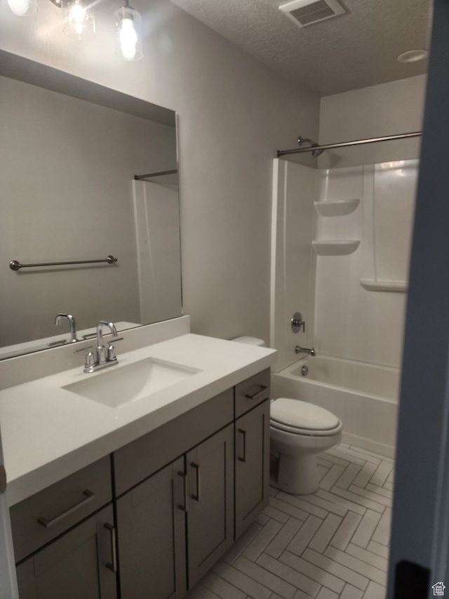 9807 N Aaron Ave Unit 210, Eagle Mountain, UT 84005 - full bathroom with vanity, shower / bathing tub combination, a textured ceiling, and toilet
