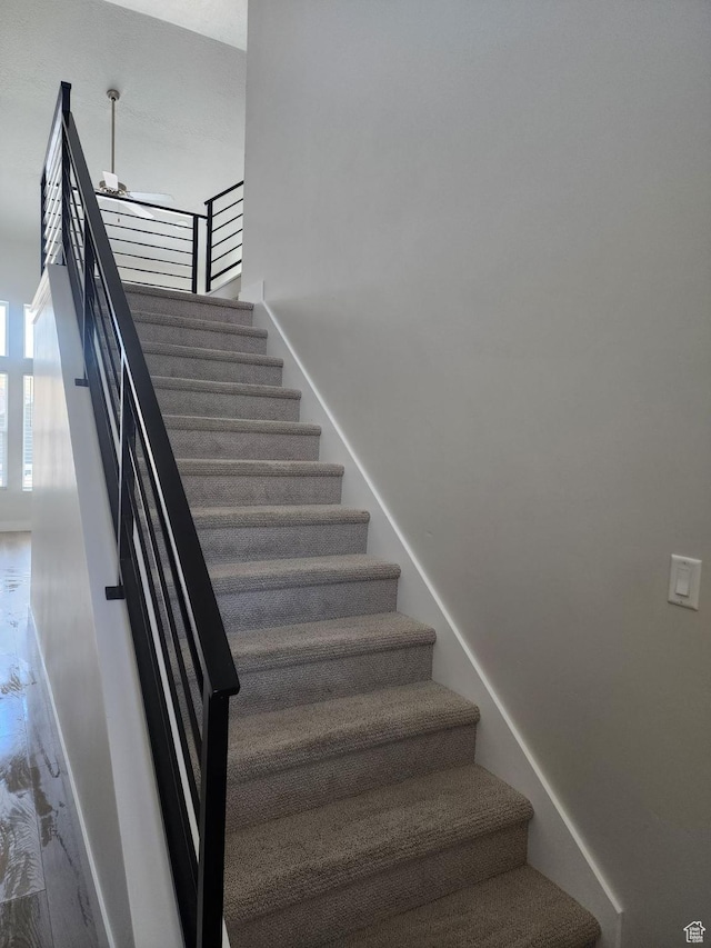 9807 N Aaron Ave Unit 210, Eagle Mountain, UT 84005 - stairway featuring baseboards