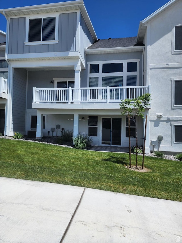 9807 N Aaron Ave Unit 210, Eagle Mountain, UT 84005 - view of front of house with board and batten siding and a front yard