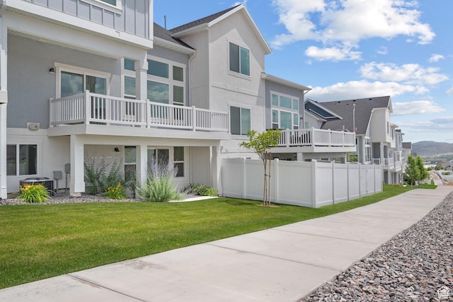 9807 N Aaron Ave Unit 210, Eagle Mountain, UT 84005 - back of property featuring stucco siding, board and batten siding, and a balcony