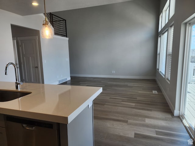 9807 N Aaron Ave Unit 210, Eagle Mountain, UT 84005 - kitchen with dishwasher, sink, decorative light fixtures, and dark wood-type flooring