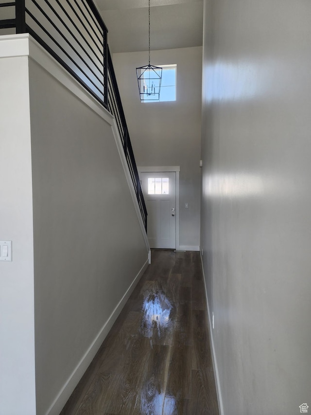 9807 N Aaron Ave Unit 210, Eagle Mountain, UT 84005 - interior space with dark hardwood / wood-style flooring, a high ceiling, and a chandelier