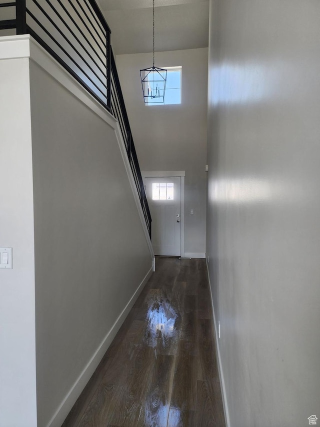 9807 N Aaron Ave Unit 210, Eagle Mountain, UT 84005 - entryway featuring baseboards, a chandelier, wood finished floors, stairway, and healthy amount of natural light