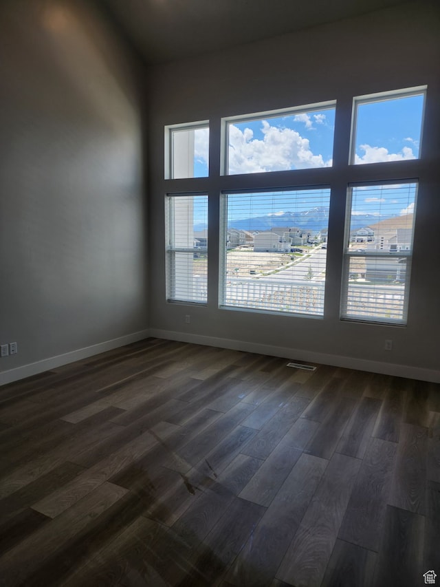 9807 N Aaron Ave Unit 210, Eagle Mountain, UT 84005 - spare room with plenty of natural light and dark hardwood / wood-style floors