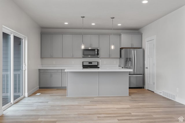 9807 N Aaron Ave Unit 210, Eagle Mountain, UT 84005 - kitchen with stainless steel appliances, gray cabinets, light countertops, and recessed lighting