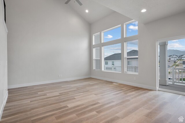 9807 N Aaron Ave Unit 210, Eagle Mountain, UT 84005 - spare room featuring light wood-type flooring, recessed lighting, high vaulted ceiling, and ceiling fan