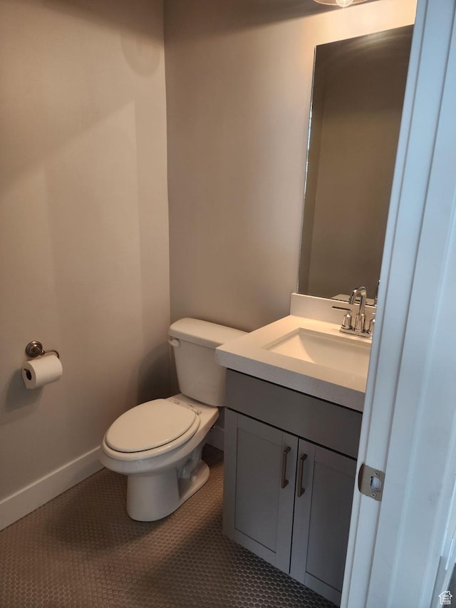 9807 N Aaron Ave Unit 210, Eagle Mountain, UT 84005 - half bath with vanity, toilet, tile patterned flooring, and baseboards