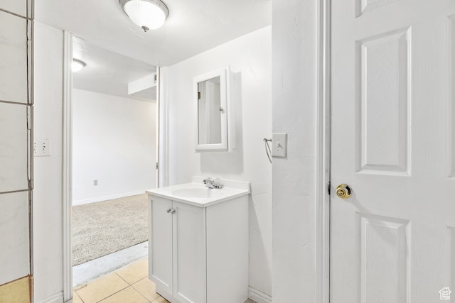 bathroom with tile patterned floors and vanity