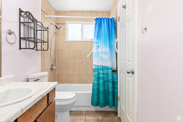 full bathroom featuring tile patterned flooring, shower / tub combo with curtain, vanity, and toilet