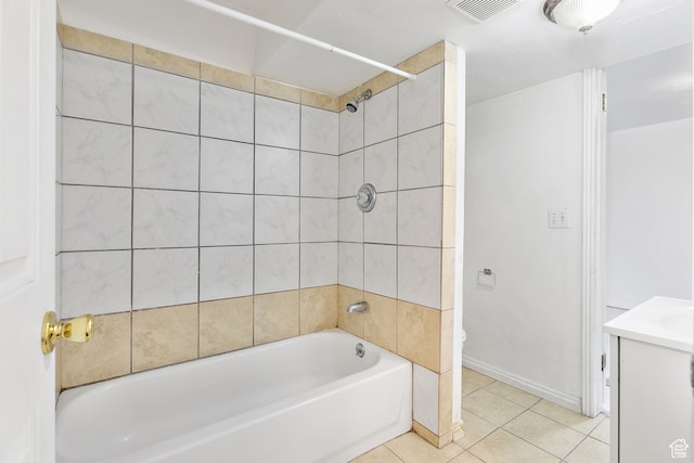 bathroom with vanity, tile patterned floors, and tiled shower / bath
