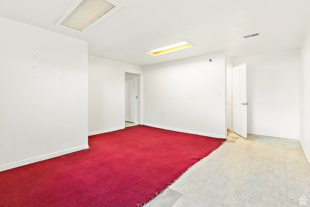 spare room with hardwood / wood-style flooring