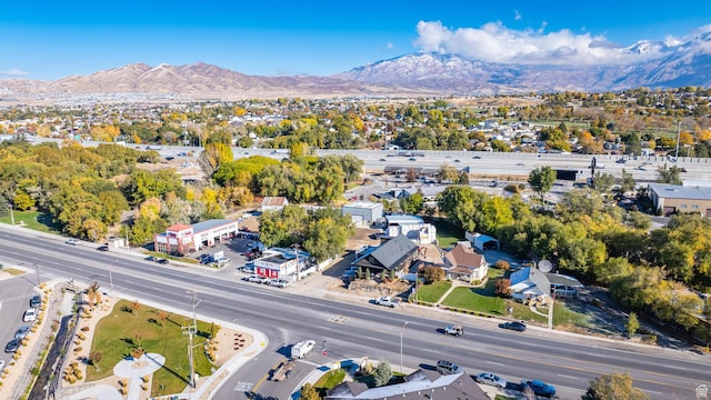 birds eye view of property with a mountain view