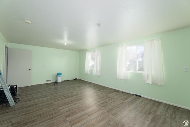 1052 N 2500 W, Vernal, UT 84078 - spare room with wood finished floors, a smoke detector, and baseboards