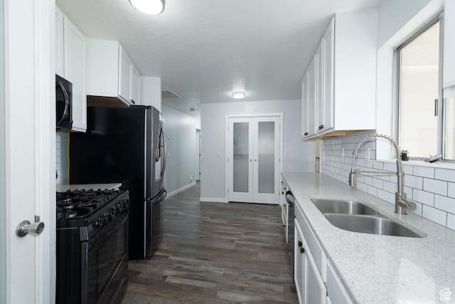 1052 N 2500 W, Vernal, UT 84078 - kitchen featuring a sink, black appliances, white cabinets, backsplash, and dark wood-type flooring