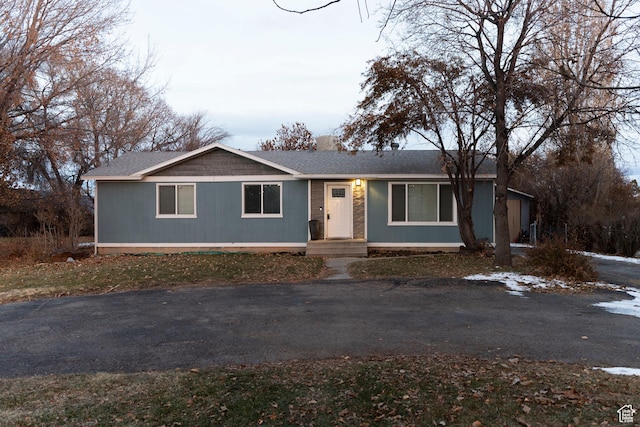 1052 N 2500 W, Vernal, UT 84078 - single story home with a shingled roof and asphalt driveway